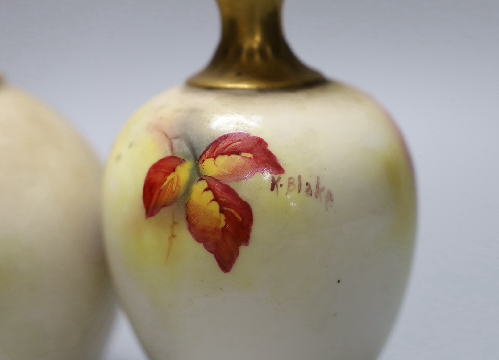 Two hand painted Royal Worcester vases, the taller signed K.Blake, the other signed H.Price, tallest 13cm